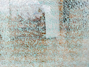 Photograph of a shattered glass window. Photograph of a shattered glass window.