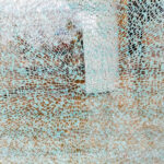 Plan S – quo vadis? Photograph of a shattered glass window.